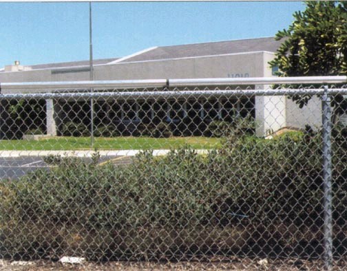 Figure 8. The Coyote Roller™ installs on top of chain link and solid fences. Image by Coyote Roller, Inc.